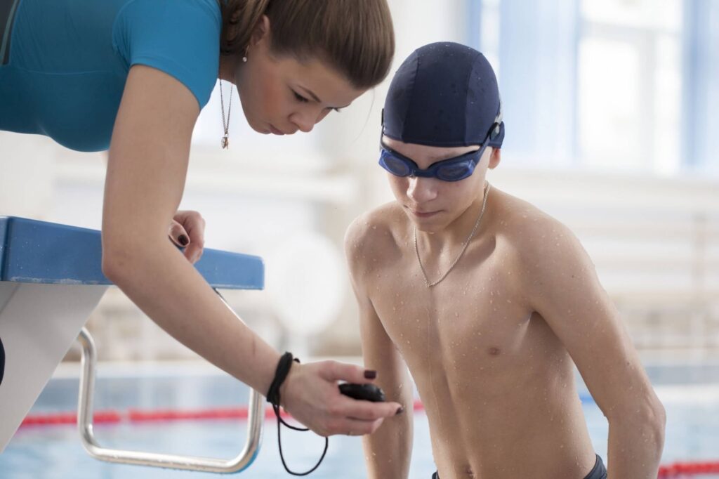 A boy having a swim session with the best private swim instructor in Sunny Isles Beach