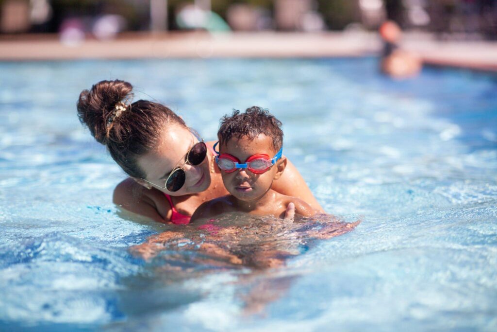 A kid enjoying her time with her swimming partner in the pools of North Miami