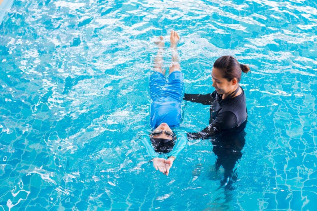 A trainee having a private swim session with the best private swim instructor in Miami Gardens